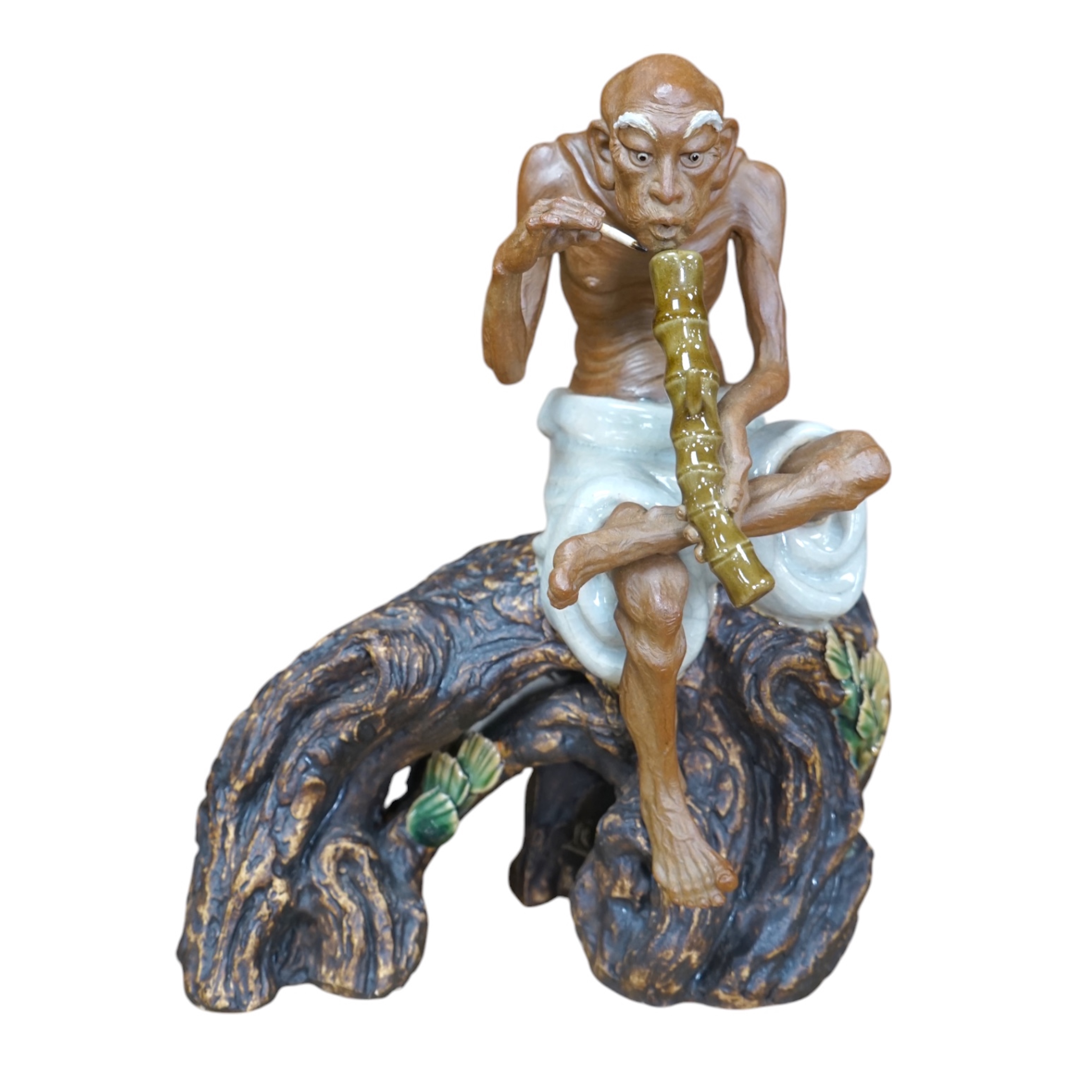 A 20th century Chinese figure of an opium smoker, maker’s seal to reverse and inscribed to interior base, 25cm. Condition - good